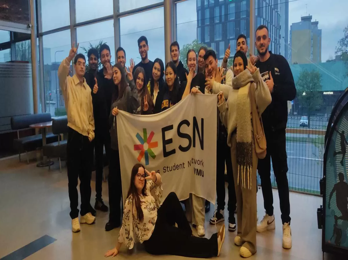 Participants standing with a ESN VMU flag