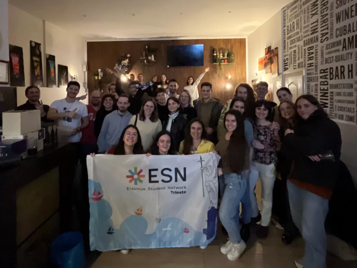 Group picture of the participants with the ESN Trieste flag.