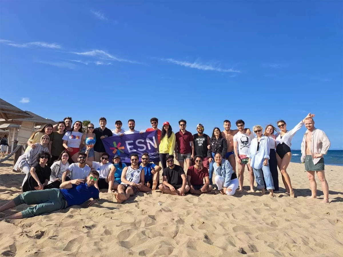 Group picture of the event at the beach