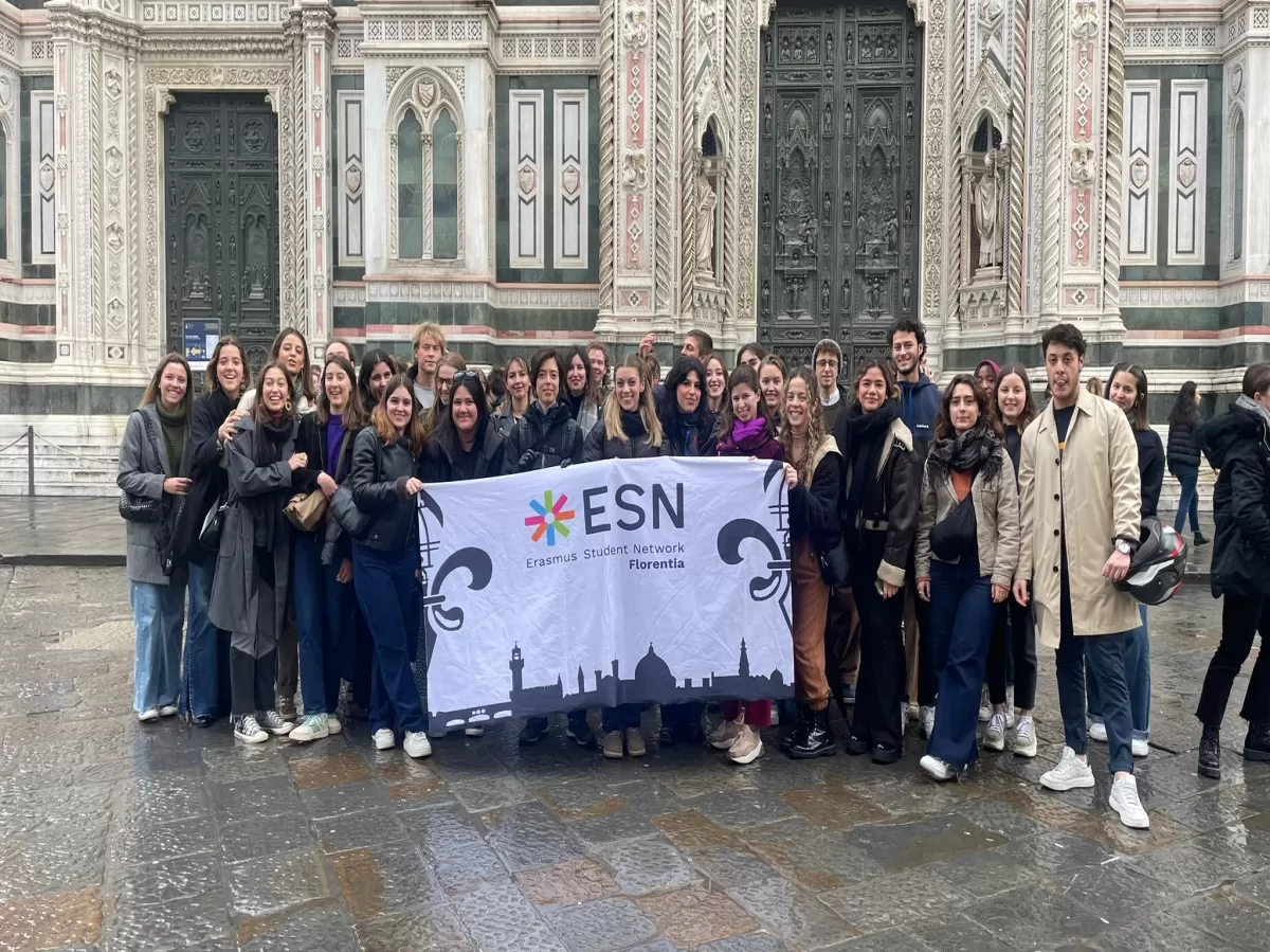 groups of international students and staff in front of the Duomo with ESN flag