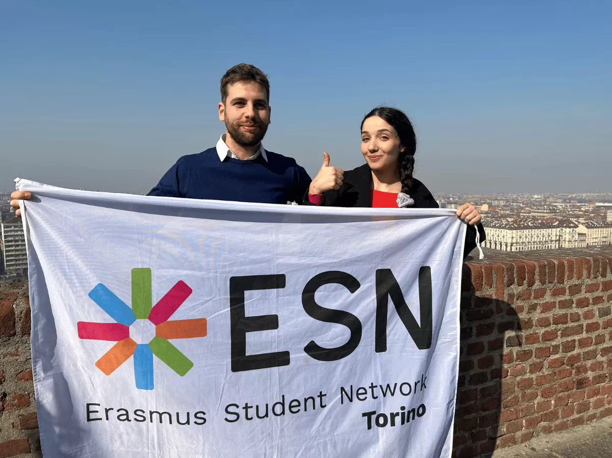 two volunteers holding the flag