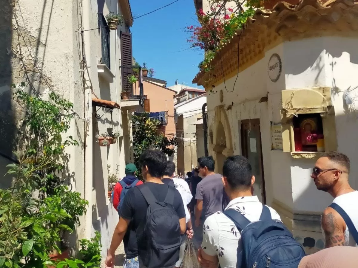 students walking through scilla's old town