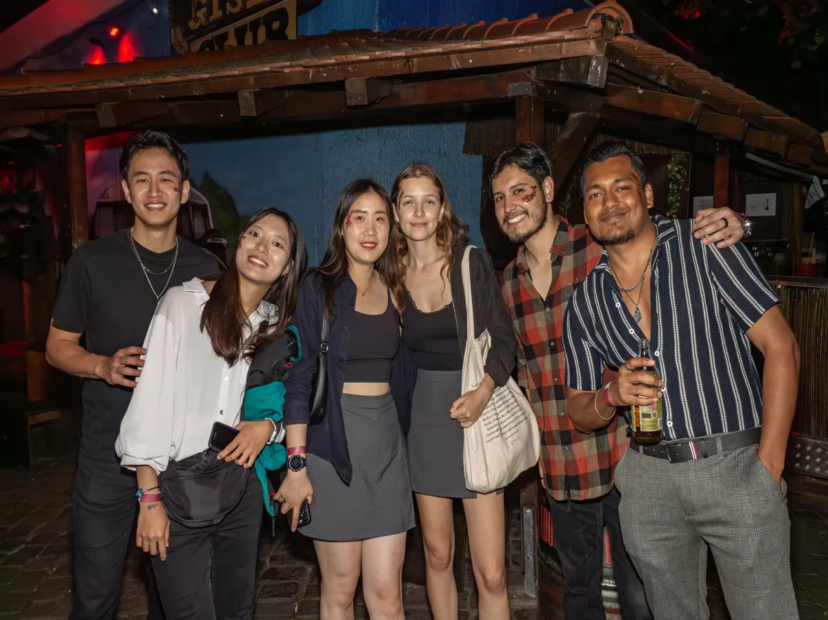 group off internationals students smiling at the camera