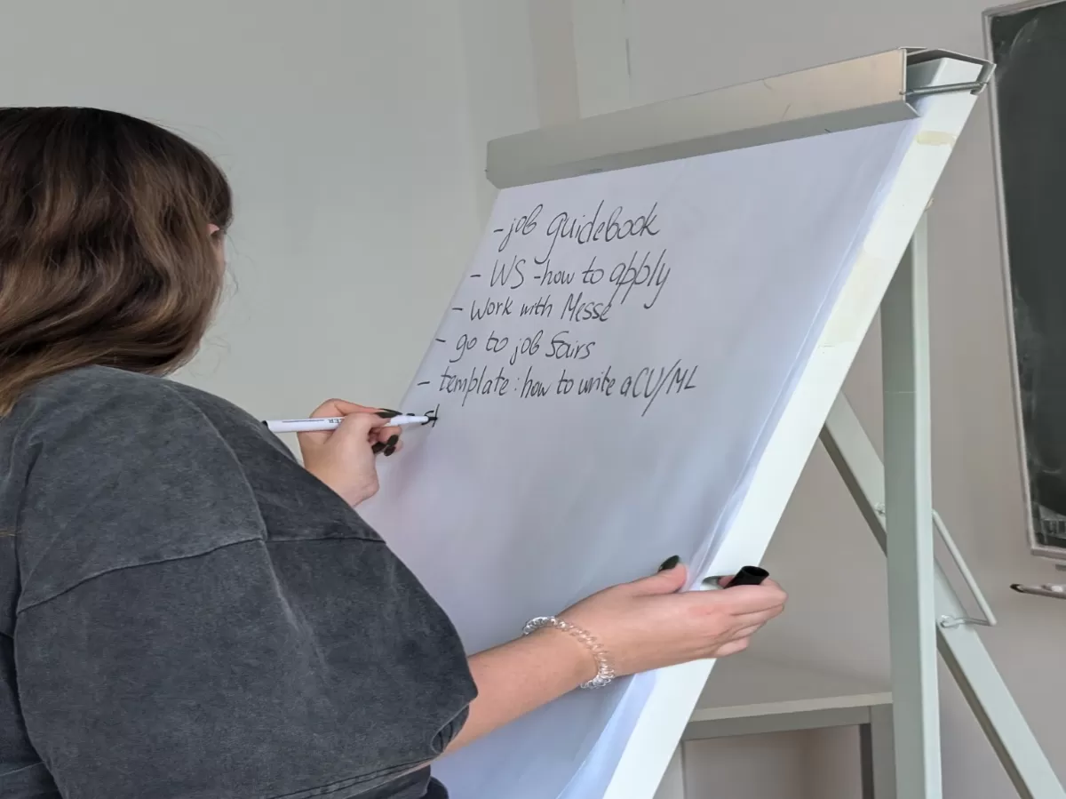 Facilitator writing brainstorming input on a flipchart