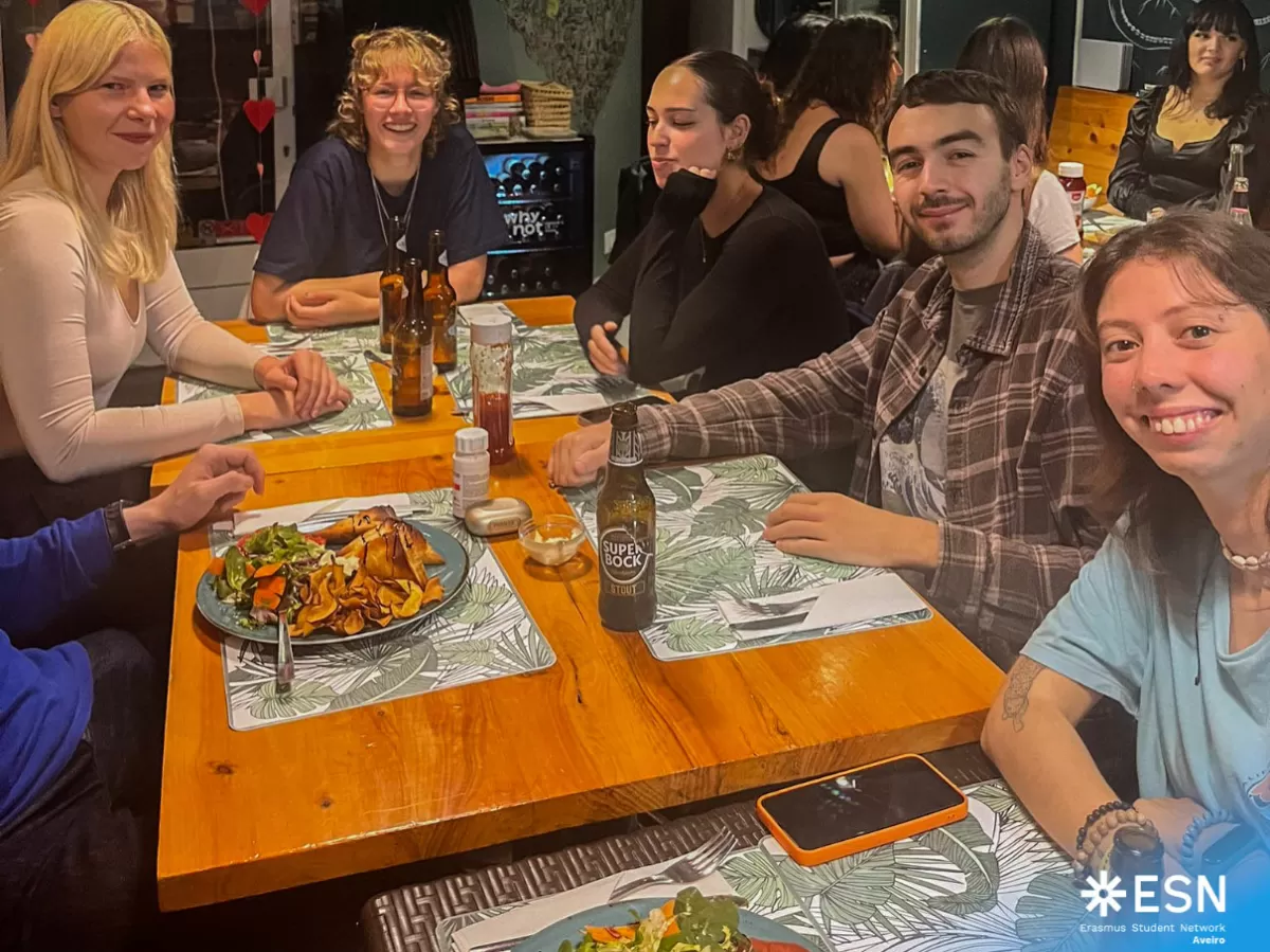 Photo group of international students having a vegan dinner.