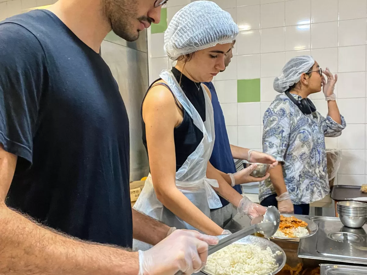 International students serving meals.