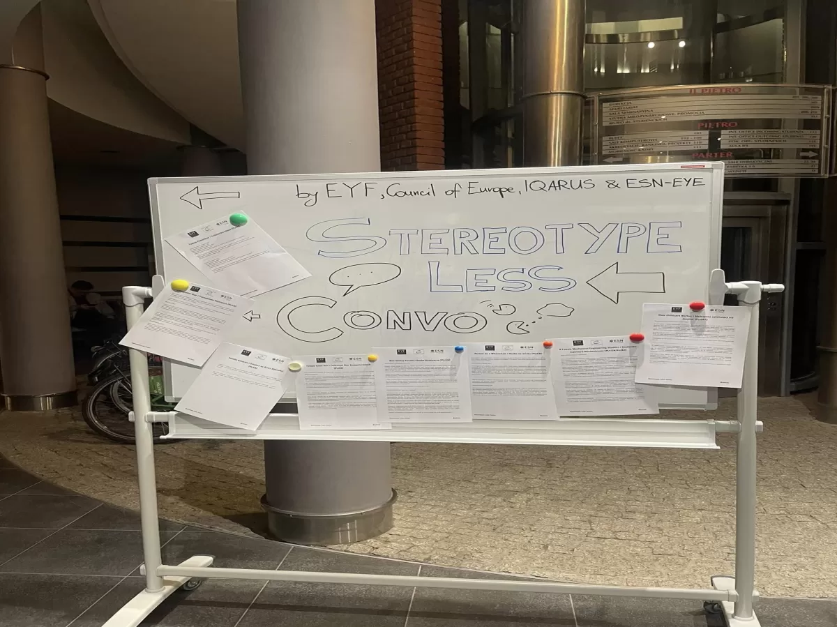 A whiteboard presenting speakers' introductions.