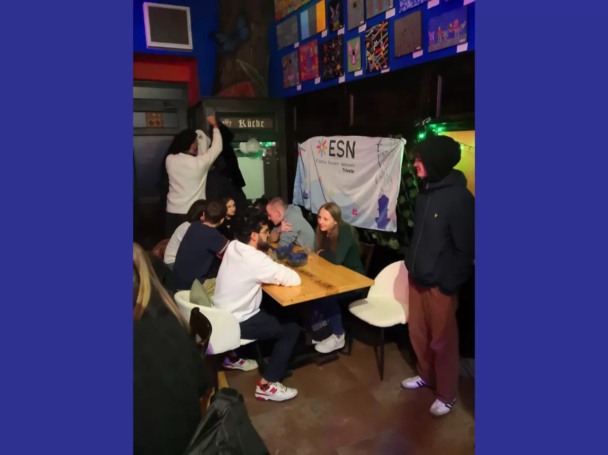 Participants sitting at the tables chatting
