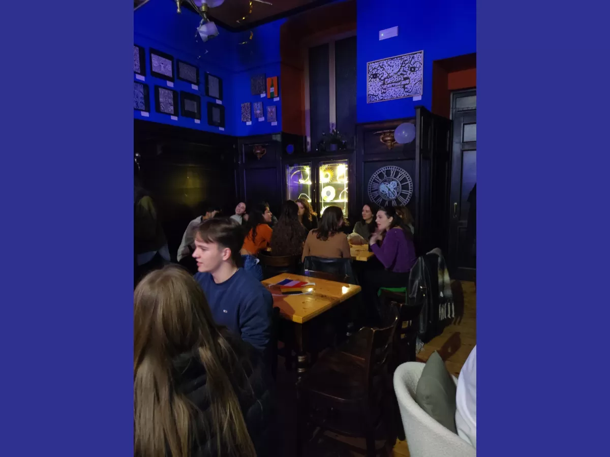 Participants sitting at the tables chatting