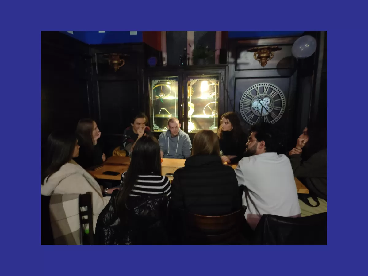 Participants sitting at the tables chatting