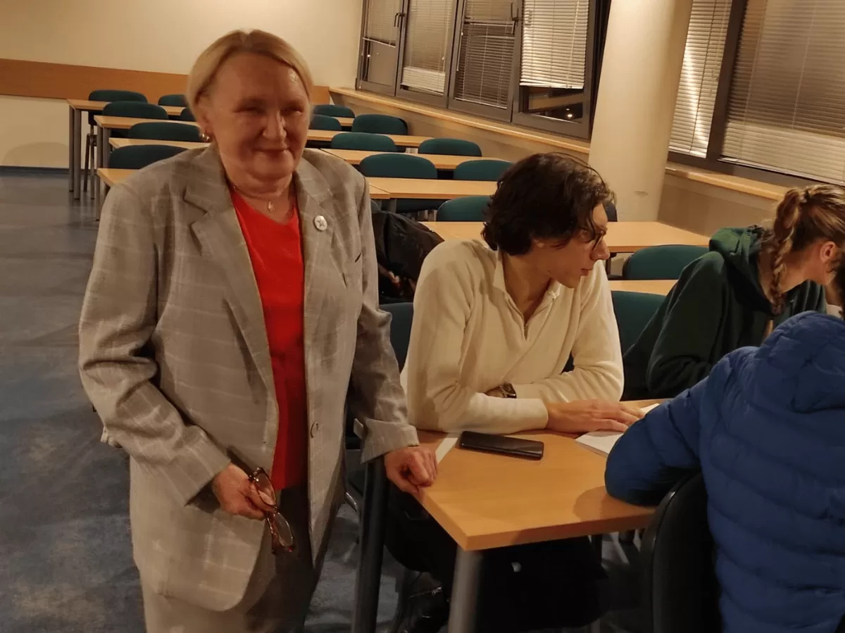 Student sitting by the table.