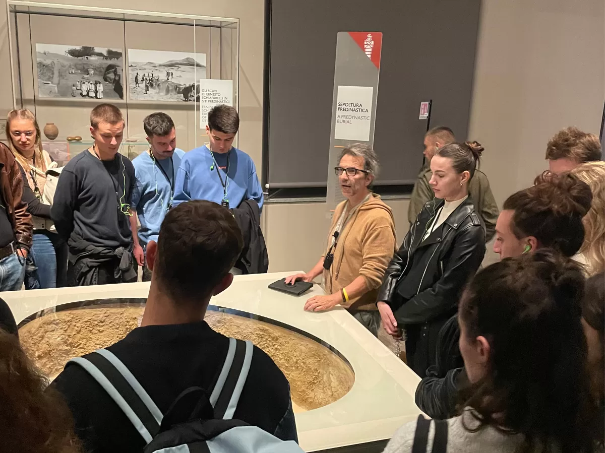 international students listening to the guide