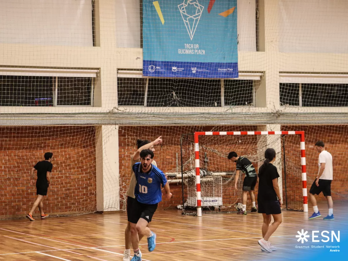 Group of international students playing futsal.