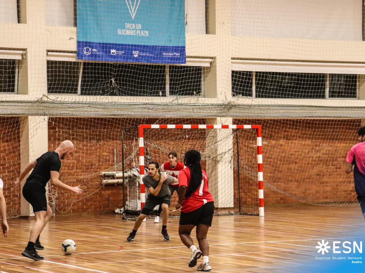 Group of international students playing futsal.