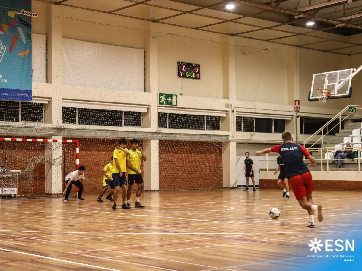 Group of international students playing futsal.