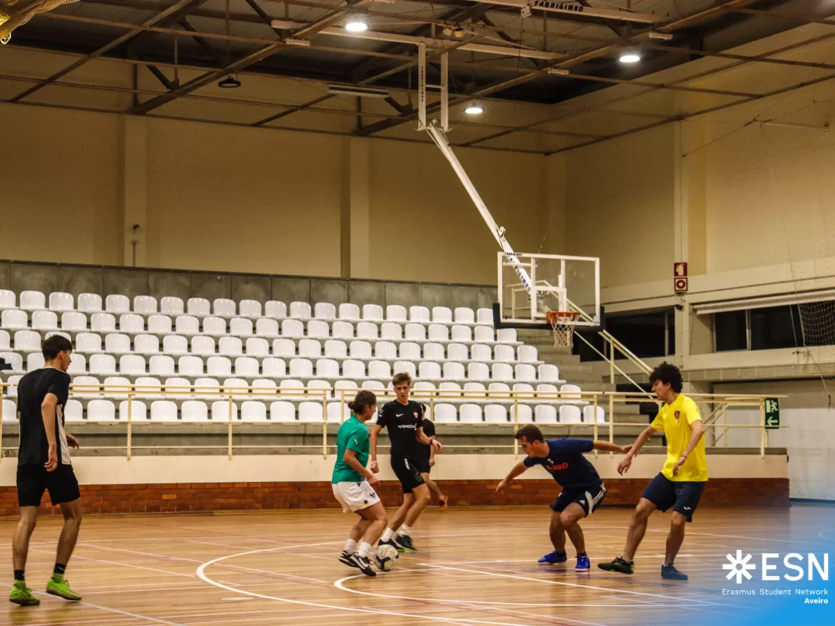 Group of international students playing futsal.