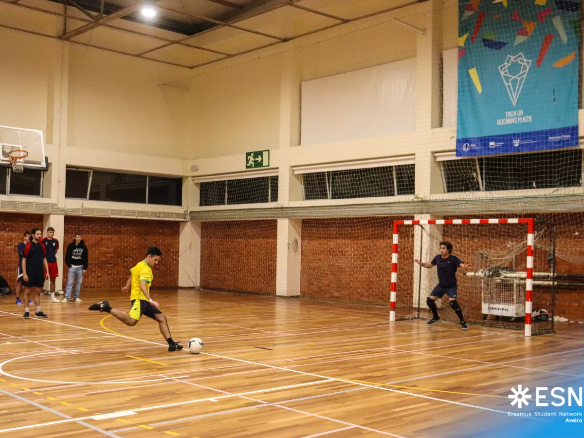 Group of international students playing futsal.