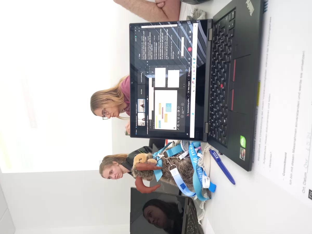 Volunteers with Mascot and Laptop