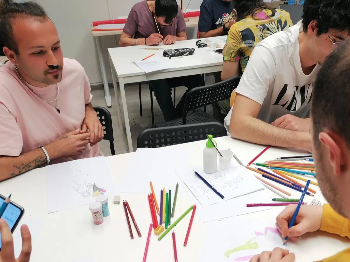 Some people socializing during the workshop