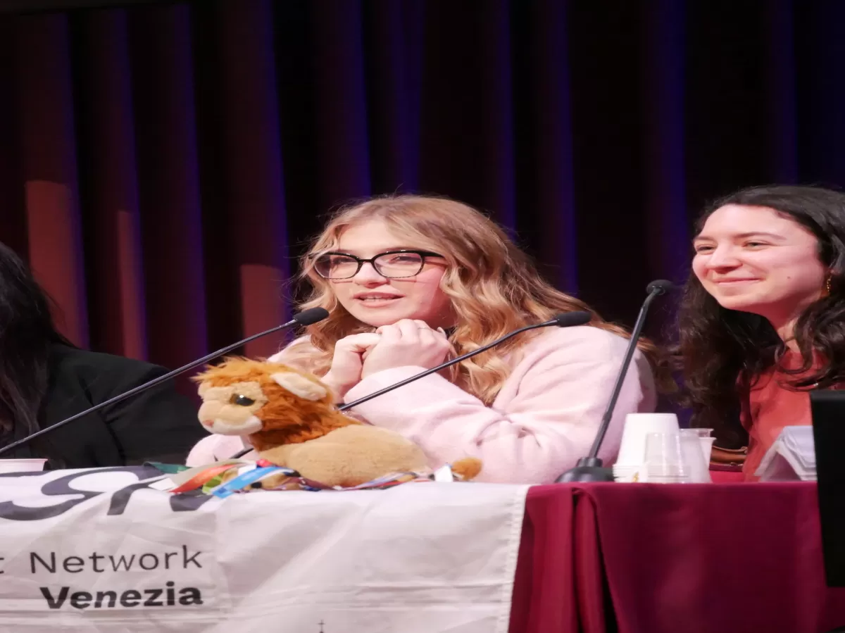 our volunteers talking to students and our mascotte