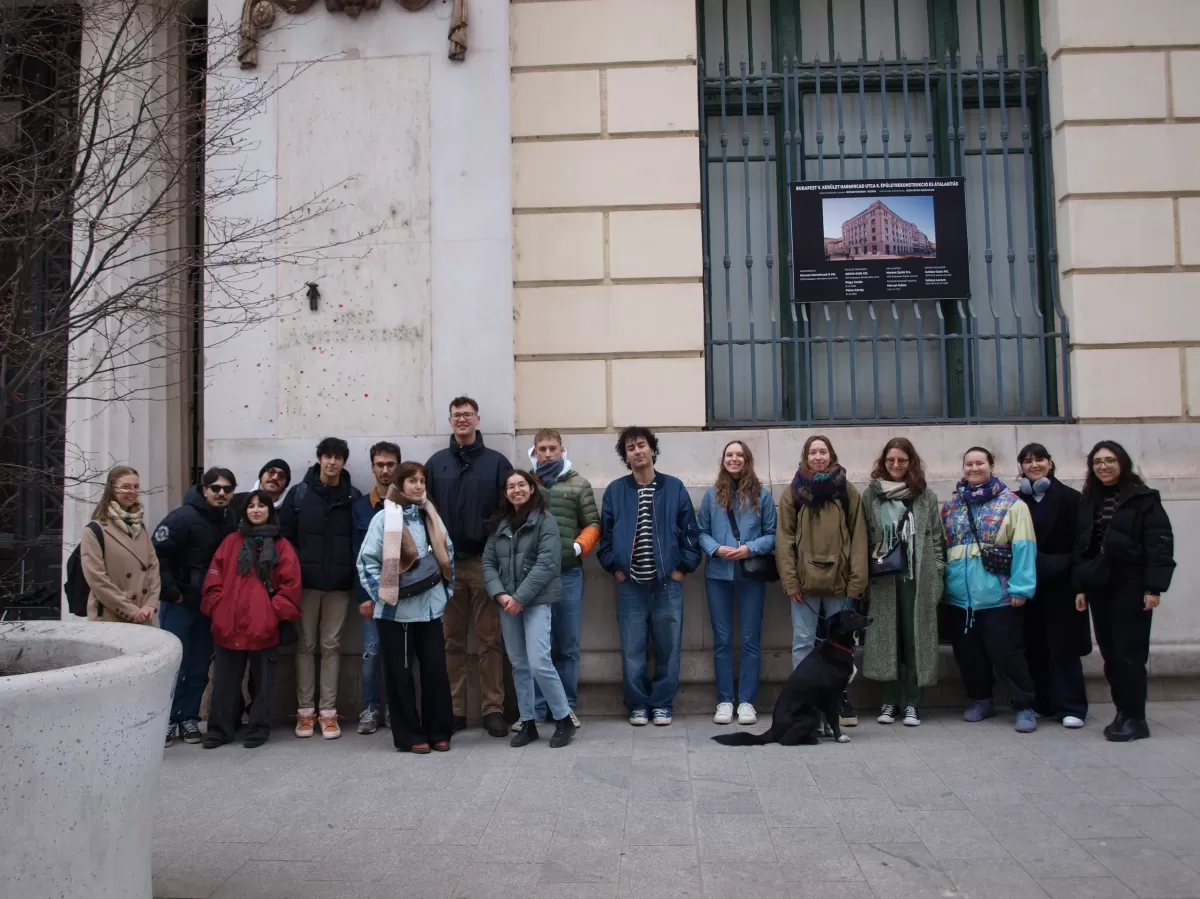 Group of international students and mentors with the "Mr. Bean's teddy bear" statue