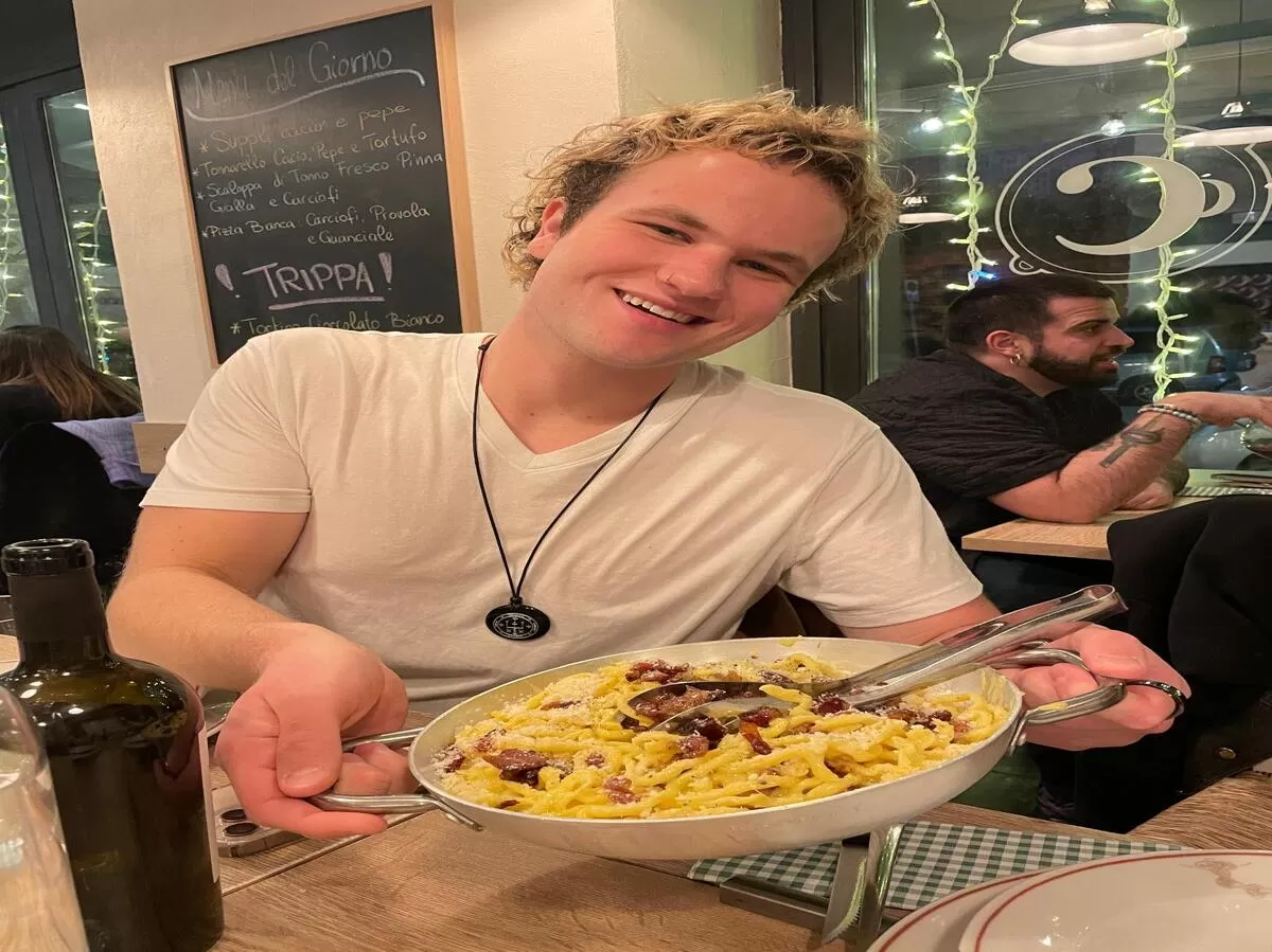 An Erasmus student showing his carbonara