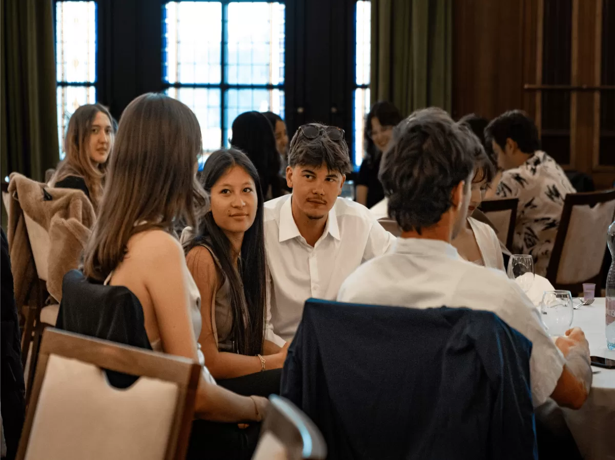 International students chatting at a table