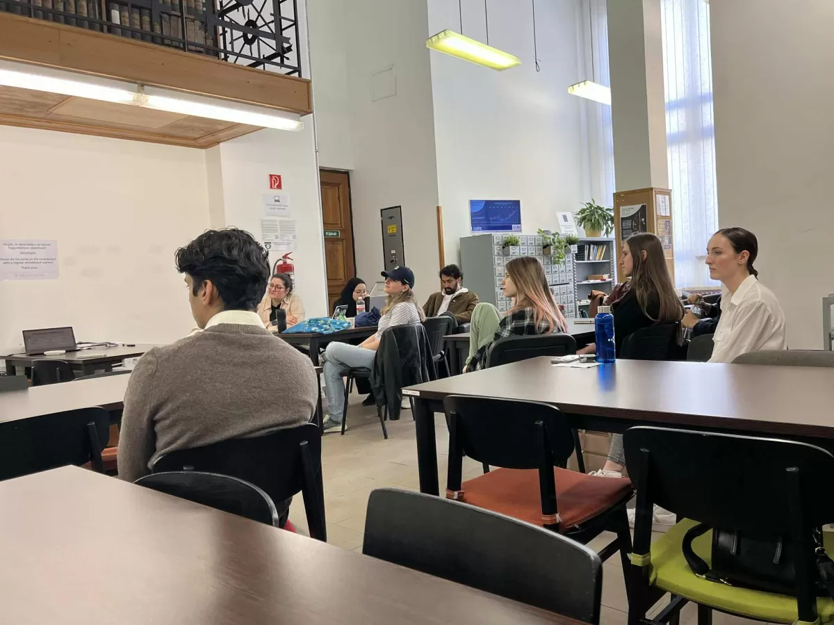 a group of people sitting in a classroom