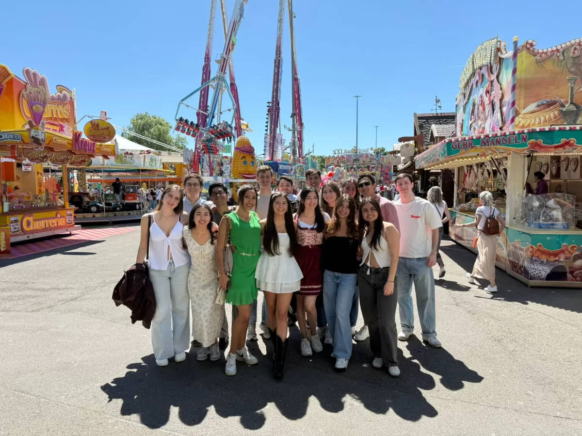A group of international students are posing for a photo