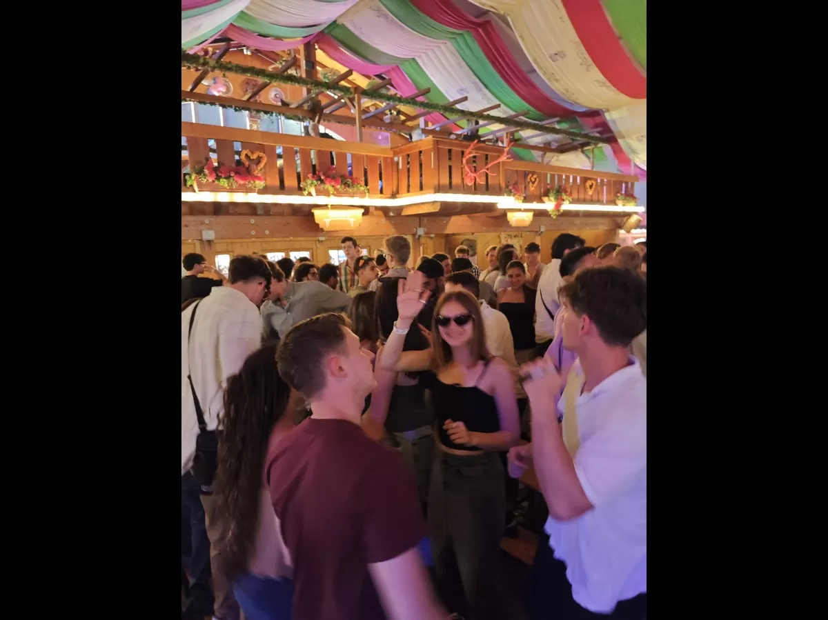 People dancing in a festival tent