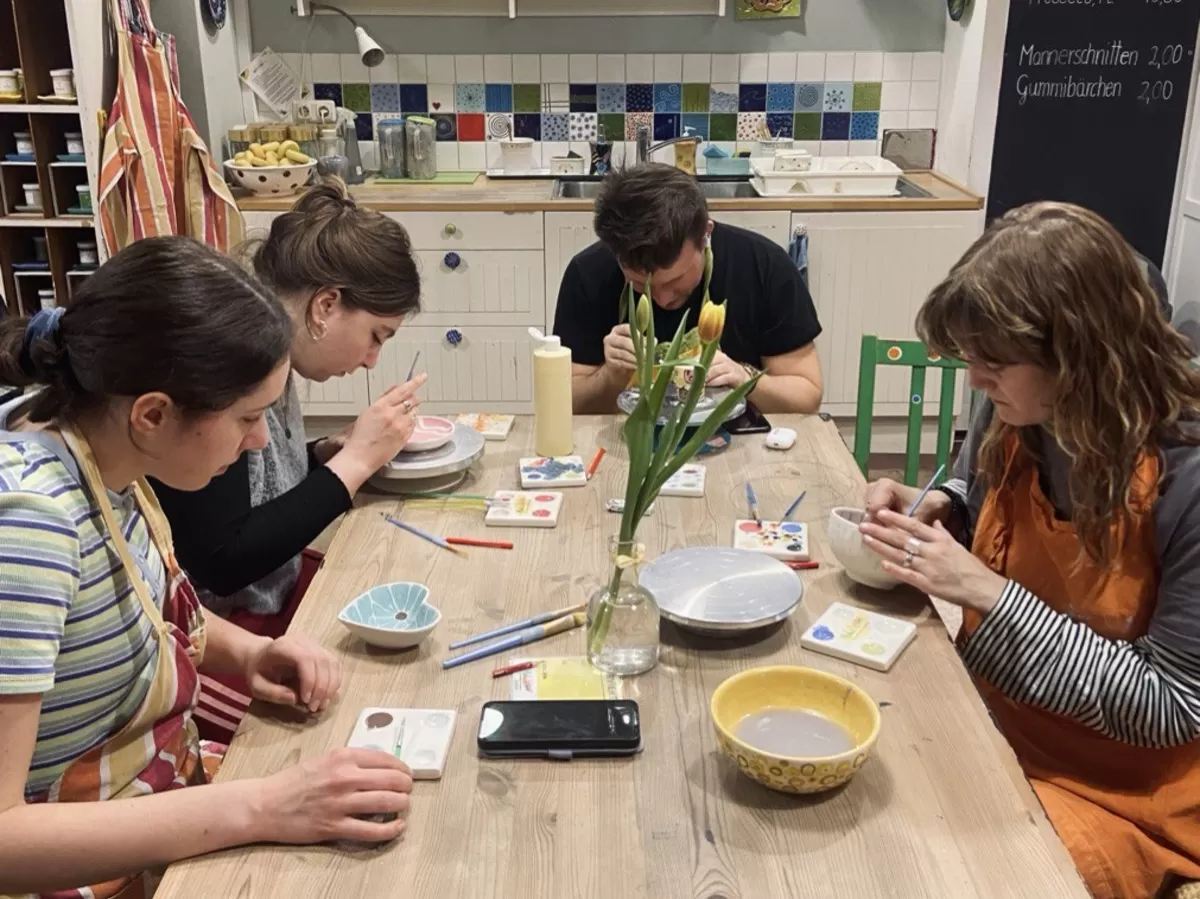 People painting clay