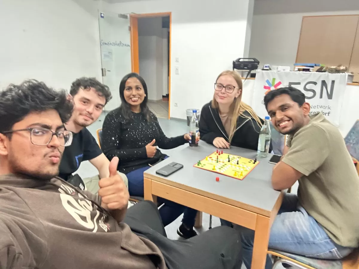 Group of students playing Mensch Ärger Dich Nicht