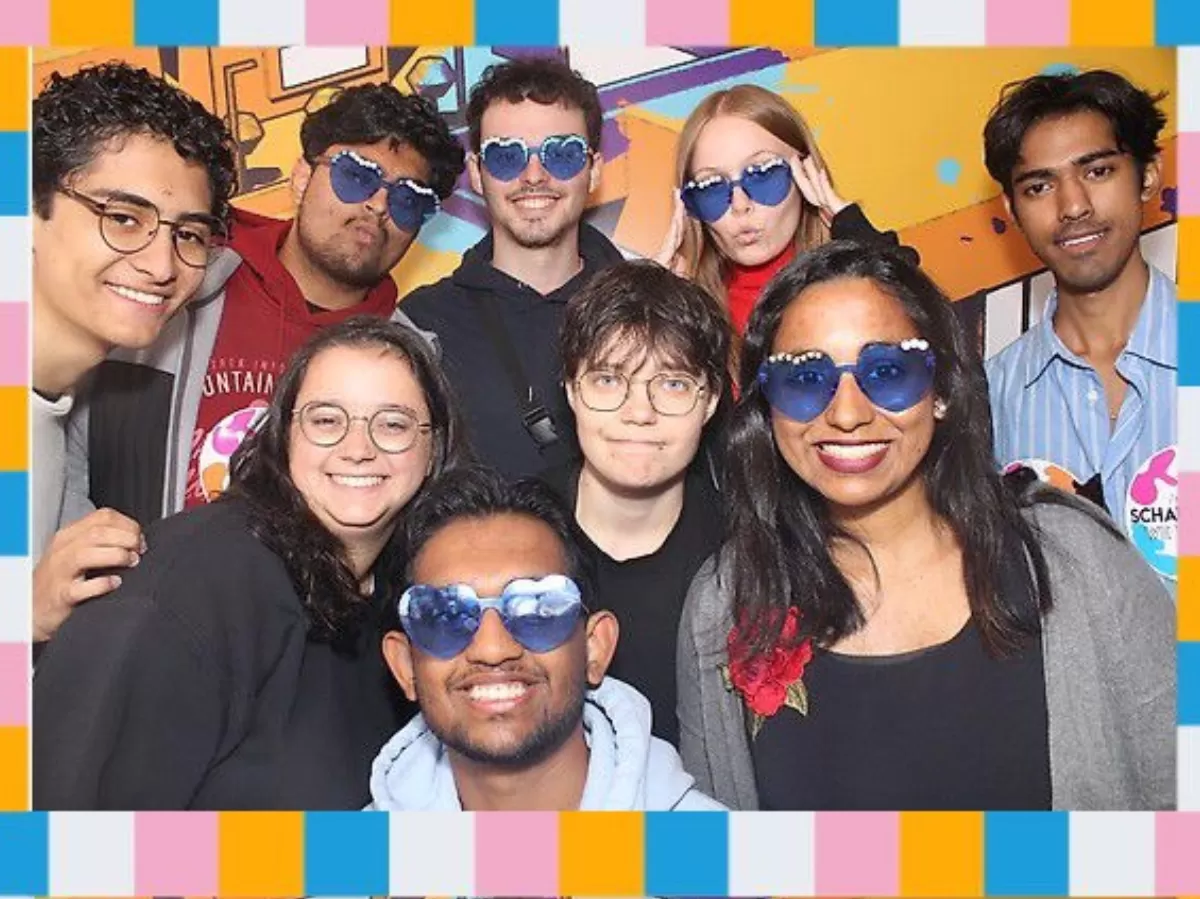 The team having fun in a photo booth