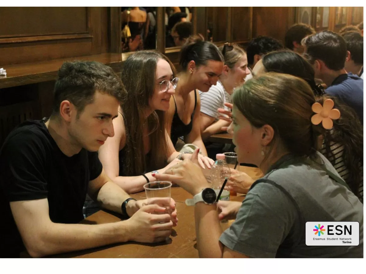 Group of people chatting in a "speed date" vibe.