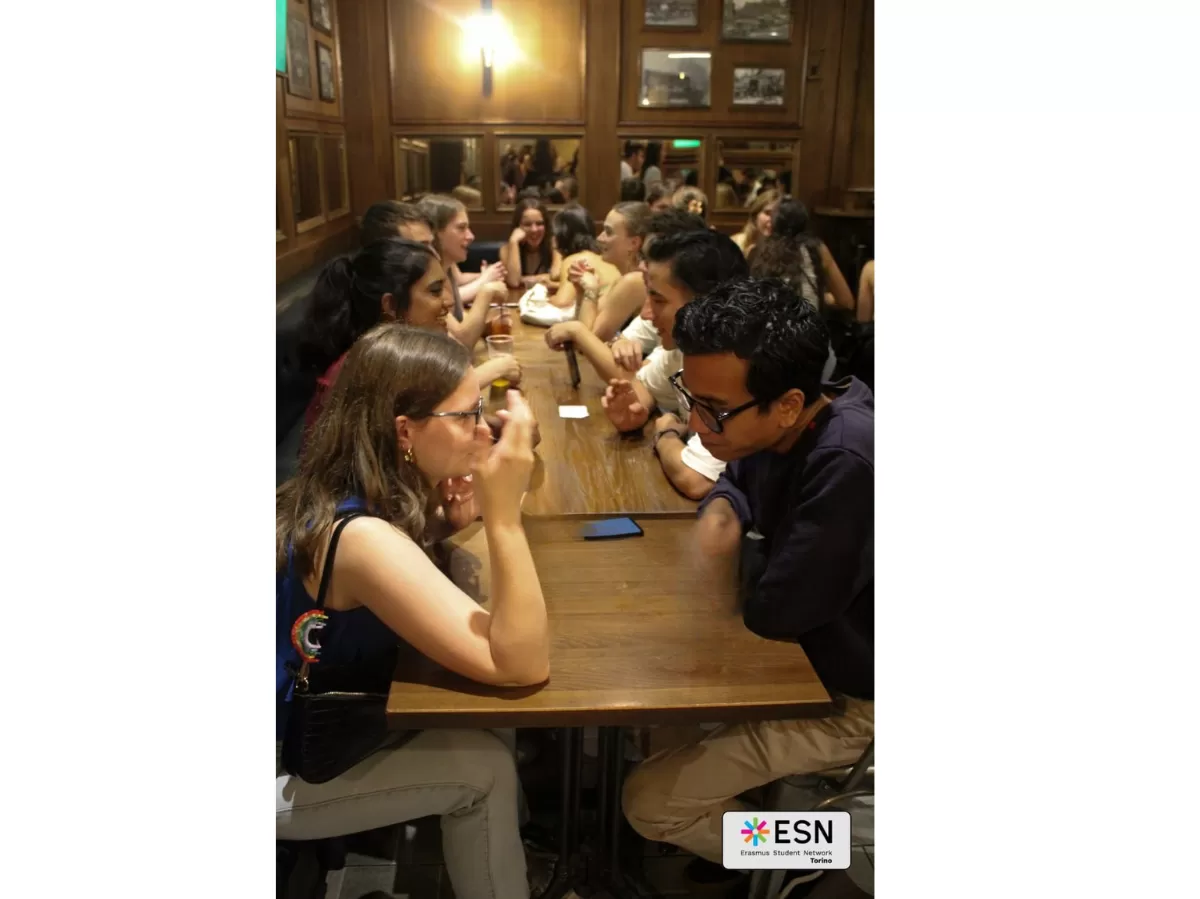 Group of people chatting in a "speed date" vibe.