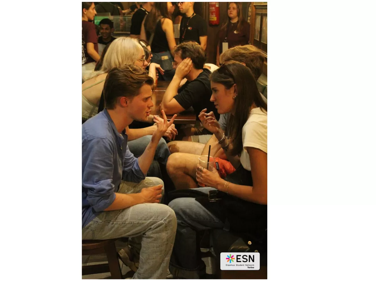 Group of people chatting in a "speed date" vibe.