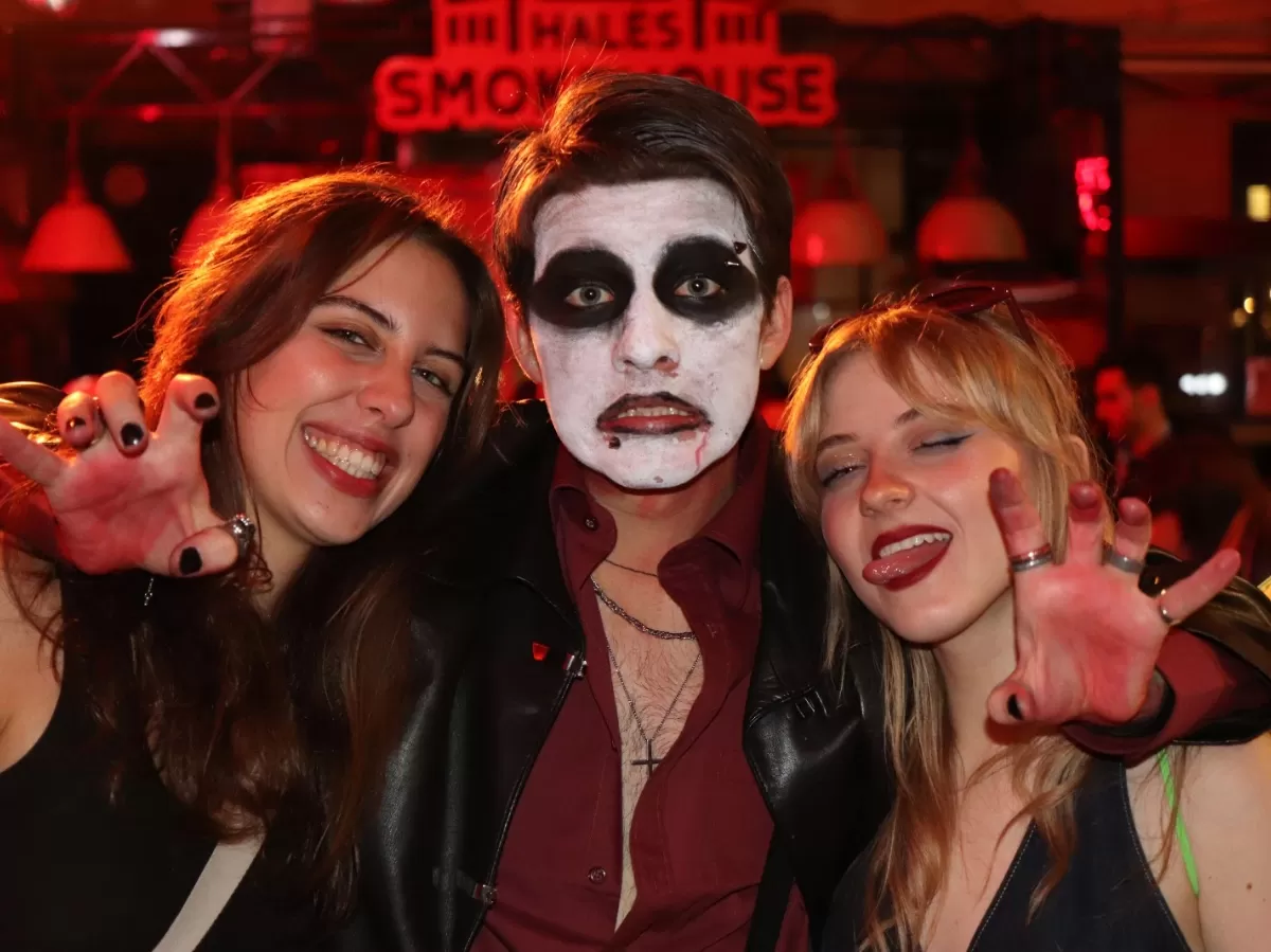 People in the halloween party posing for a photo