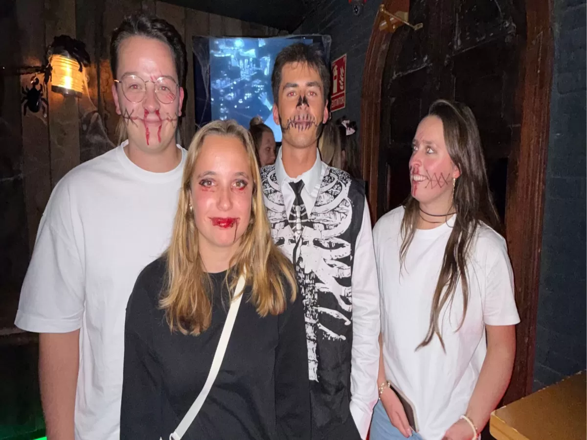 Group of 4 people smiling