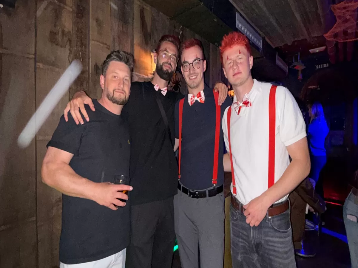 Group of 4 people smiling