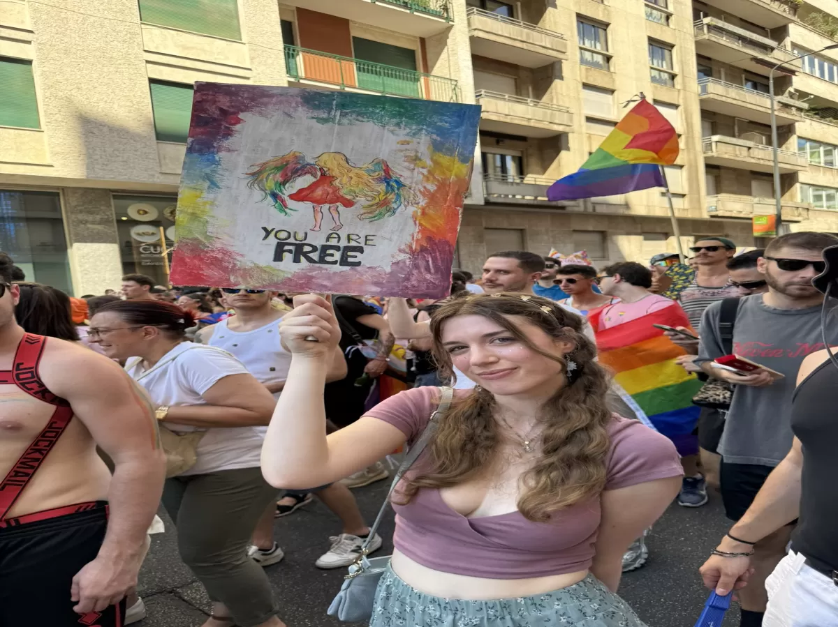 ESN volunteer holding a banner during Milano Pride