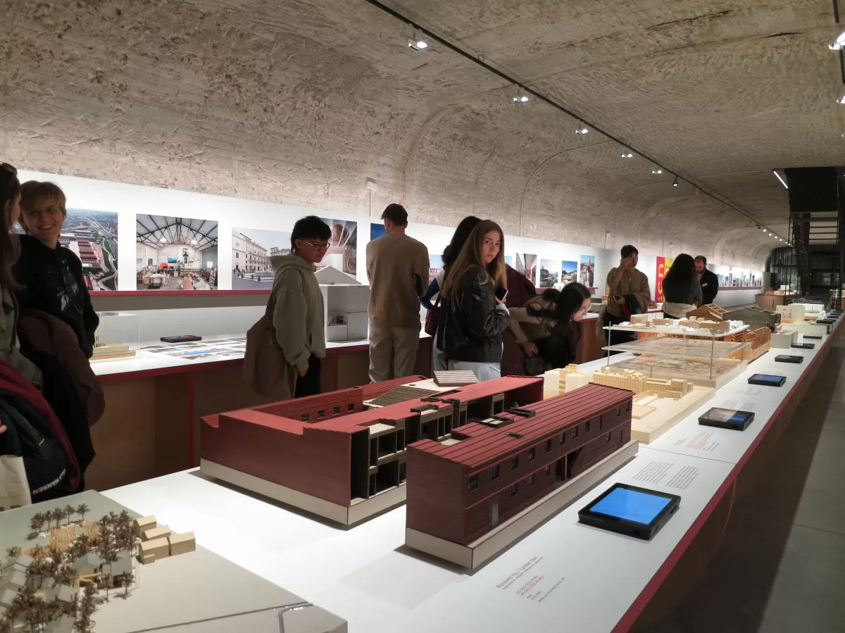 People looking at architecture models