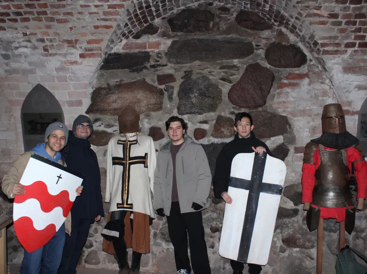 Students are standing with the traditional stuff.