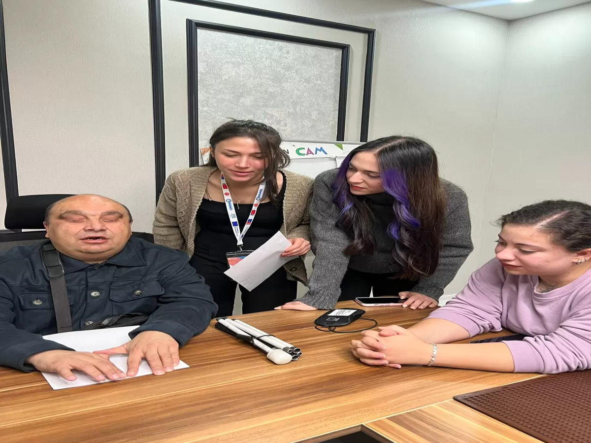 Our members learning braille alphabet.