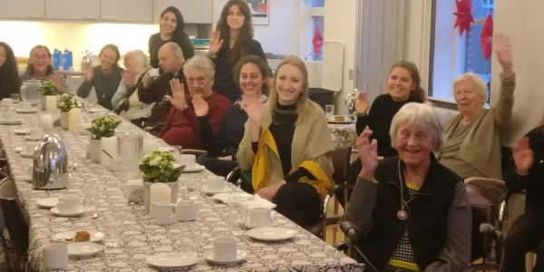 Group picture by the international students and the residents of the elderly care