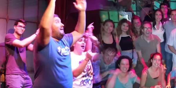 In the left, ESN coordinators dancing and teaching a reggaeton dance to Ludàlia users. In the right, a group photo with some coordinators and local Ludàlia users.