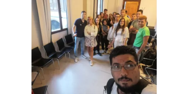 An international students takes a selfie with other students and ESNers