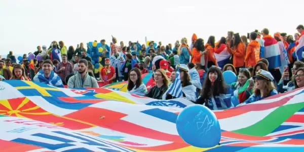 Group of international students during a flag parade.