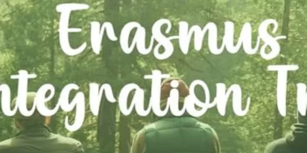 Big, white written text: Erasmus Integration Trip on the green background with Forest.