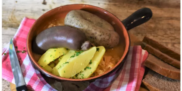 plate with sauerkraut and blood sausages