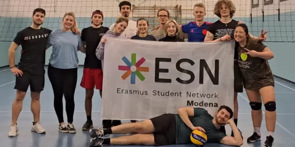 People after playing volleyball with ESN flag